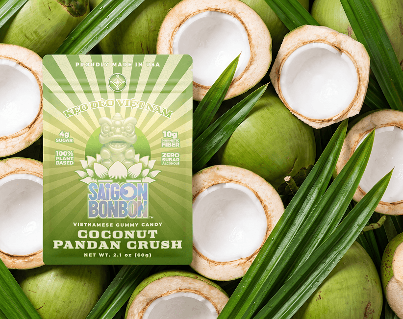 Coconut Pandan Crush pouch on fresh young coconuts and pandan leaves