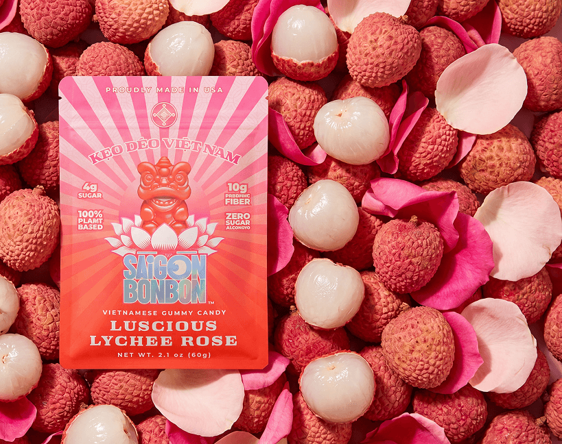Luscious Lychee Rose pouch on a bed of fresh lychees