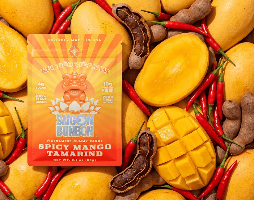 Spicy Mango Tamarind pouch on ripe mangoes, chillies and tamarind