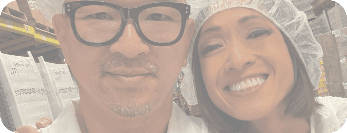 Michael and Tee in hairnets on the production floor